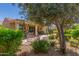 This house has a lovely backyard area with a stone patio and plenty of beautiful greenery at 27088 W Sequoia Dr, Buckeye, AZ 85396