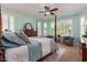 Bright main bedroom with bay windows, ceiling fan, and soothing paint color create a relaxing atmosphere at 27088 W Sequoia Dr, Buckeye, AZ 85396