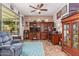 A spacious home office featuring custom wooden built-ins, dual work stations, and ample natural light at 27088 W Sequoia Dr, Buckeye, AZ 85396