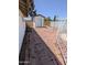 Spacious backyard featuring a storage shed and brick-paved area, perfect for outdoor activities at 2934 W Northview Ave, Phoenix, AZ 85051