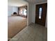Inviting entryway features tile flooring and access to living room with a unique arched window at 2934 W Northview Ave, Phoenix, AZ 85051