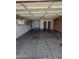 An empty garage with brick trim, utility hookups, and storage space at 2934 W Northview Ave, Phoenix, AZ 85051
