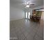 Spacious living room features tile flooring, bar seating, and natural light from French doors at 2934 W Northview Ave, Phoenix, AZ 85051