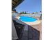 In-ground kidney bean-shaped pool with a concrete and paver surround at 2934 W Northview Ave, Phoenix, AZ 85051