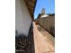 The side yard features a walkway, brick pavers and desert landscaping at 2934 W Northview Ave, Phoenix, AZ 85051