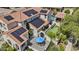 Aerial view of stunning home with solar panels, manicured backyard, pool, and outdoor living space at 2985 N Point Ridge Rd, Buckeye, AZ 85396