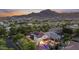 An aerial perspective shows a beautiful home with a pool, landscaping, and mountain views at 2985 N Point Ridge Rd, Buckeye, AZ 85396