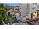 Expansive backyard featuring a putting green, modern home design, and tiled roof at 2985 N Point Ridge Rd, Buckeye, AZ 85396