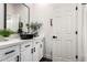 Modern bathroom features black vessel sink, white cabinets, and quartz countertop at 2985 N Point Ridge Rd, Buckeye, AZ 85396