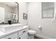 Modern bathroom features a square sink, sleek black fixtures, and a glass-enclosed shower at 2985 N Point Ridge Rd, Buckeye, AZ 85396