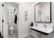 Bright bathroom features a clawfoot sink, patterned tile floors, and modern fixtures at 2985 N Point Ridge Rd, Buckeye, AZ 85396