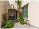 Enchanting courtyard with stone pavers, potted plants, and climbing vines at 2985 N Point Ridge Rd, Buckeye, AZ 85396