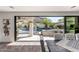 Seamless indoor-outdoor living through a large glass sliding door to the stunning private pool area at 2985 N Point Ridge Rd, Buckeye, AZ 85396
