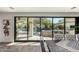 Dining area with seamless indoor-outdoor living through a large glass sliding door to the stunning private pool area at 2985 N Point Ridge Rd, Buckeye, AZ 85396