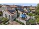 Stunning home exterior featuring a tile roof, solar panels, and outdoor dining area at 2985 N Point Ridge Rd, Buckeye, AZ 85396