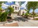 Charming two-story home with a well-manicured front yard and neutral stucco exterior at 2985 N Point Ridge Rd, Buckeye, AZ 85396