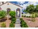 Inviting front entrance with beautiful stone steps and an arched doorway with blue tile accents at 2985 N Point Ridge Rd, Buckeye, AZ 85396