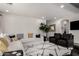 Beautiful living room with wood-look tile flooring, neutral walls, area rug, and comfortable seating at 2985 N Point Ridge Rd, Buckeye, AZ 85396
