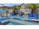 Stunning pool with tiled water features and lush landscaping, perfect for relaxing outdoors at 2985 N Point Ridge Rd, Buckeye, AZ 85396