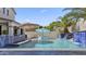 A gorgeous backyard pool with blue tiles, luxurious features, and plenty of room to relax at 2985 N Point Ridge Rd, Buckeye, AZ 85396