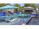 Beautiful pool with cascading waterfalls, blue tile, and swim-up lounge chairs at 2985 N Point Ridge Rd, Buckeye, AZ 85396