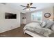 This main bedroom features neutral colored walls, light brown carpet, and a window with white shutters at 3048 W Thorn Tree Dr, Phoenix, AZ 85085