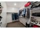 Spacious walk-in closet with shelving, hanging rods, and storage space for clothes and accessories at 3048 W Thorn Tree Dr, Phoenix, AZ 85085
