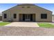 Spacious backyard with a paved patio, artificial turf, and low-maintenance desert landscaping at 30776 W Earll Dr, Buckeye, AZ 85396