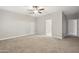 This carpeted primary bedroom has access to the primary bathroom at 30776 W Earll Dr, Buckeye, AZ 85396
