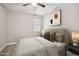 Serene bedroom with neutral tones, a plush bed, and contemporary decor for a relaxing retreat at 30776 W Earll Dr, Buckeye, AZ 85396