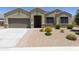 Charming single-story home featuring a well-manicured, low maintenance front yard and a two-car garage at 30776 W Earll Dr, Buckeye, AZ 85396