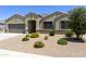 Charming single-story home with well-maintained desert landscaping and a two-car garage at 30776 W Earll Dr, Buckeye, AZ 85396