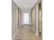 Inviting hallway with neutral paint, leading to the main living areas at 30776 W Earll Dr, Buckeye, AZ 85396
