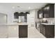 Kitchen featuring a center island, stainless steel appliances, and ample cabinet space at 30776 W Earll Dr, Buckeye, AZ 85396