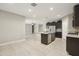 Spacious kitchen boasts stainless appliances, a large island with granite countertops, and ample storage at 30776 W Earll Dr, Buckeye, AZ 85396