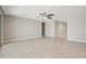 Bright living room featuring tile flooring and a ceiling fan at 30776 W Earll Dr, Buckeye, AZ 85396