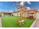 The private backyard features a covered patio, pavers, seating, and low maintenance landscaping at 3819 N Springfield St, Buckeye, AZ 85396