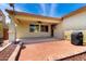 Spacious covered backyard patio with a barbecue grill and a view of the landscaped yard at 3819 N Springfield St, Buckeye, AZ 85396