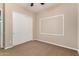 Versatile bedroom space featuring double-door closet and flexible layout, offering options for relaxation or creative use at 3819 N Springfield St, Buckeye, AZ 85396
