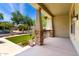 Inviting covered front porch framed by brick pillars, offering a welcoming outdoor space at 3819 N Springfield St, Buckeye, AZ 85396