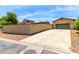 Home exterior showcasing a long driveway and low-maintenance landscaping at 3819 N Springfield St, Buckeye, AZ 85396