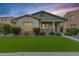 Charming single-Gathering home boasting mature landscaping, a cozy porch, and vibrant curb appeal at 3819 N Springfield St, Buckeye, AZ 85396