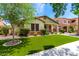 Well-kept front yard showcasing lush greenery and an inviting facade at 3819 N Springfield St, Buckeye, AZ 85396