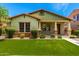 Charming home featuring a manicured front lawn and inviting porch at 3819 N Springfield St, Buckeye, AZ 85396