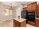 The kitchen includes updated stainless steel appliances and a center island, great for food prep at 3819 N Springfield St, Buckeye, AZ 85396