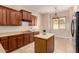Well-lit kitchen with granite counters, ample cabinet space, and a convenient center island at 3819 N Springfield St, Buckeye, AZ 85396