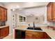 Kitchen sink and countertops with view to living area. Good for entertaining! at 3819 N Springfield St, Buckeye, AZ 85396