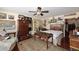 Bedroom featuring a ceiling fan, an assortment of decor and furniture, as well as a doorway to the exterior at 4317 N 70Th St, Scottsdale, AZ 85251