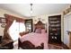Cozy bedroom with a queen-size bed, chandelier, and ample natural light creating a serene retreat at 4317 N 70Th St, Scottsdale, AZ 85251