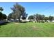 Expansive grassy common area with mature trees, picnic tables, and open space at 4317 N 70Th St, Scottsdale, AZ 85251